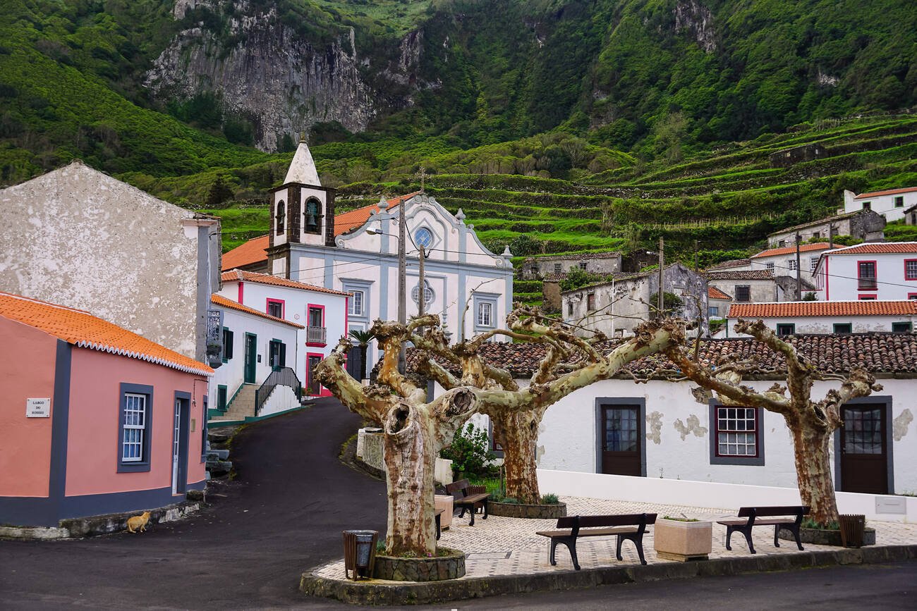 Colorful building with a green mountain in the back