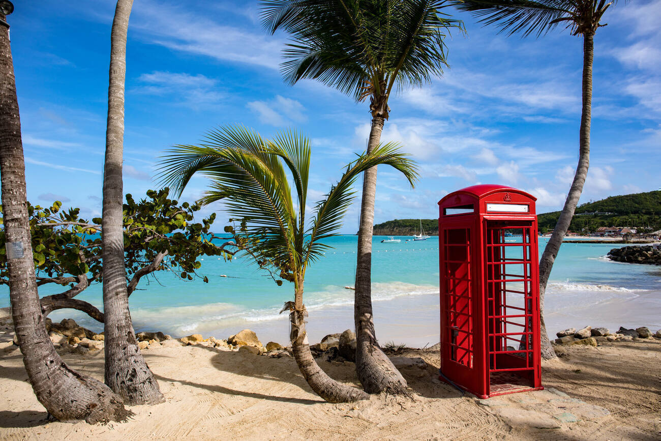 Red phone booth on the beach