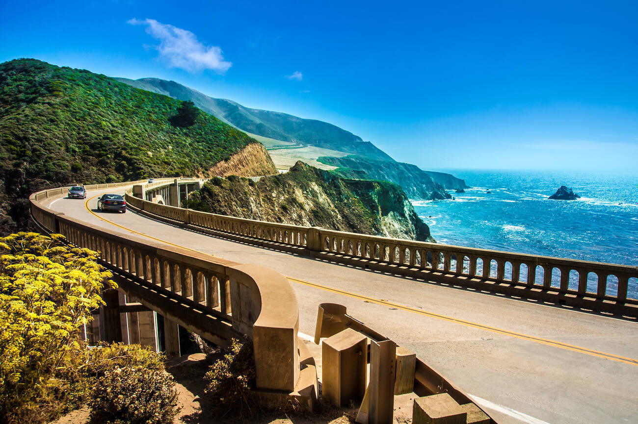 Cars driving on a bridge over the water