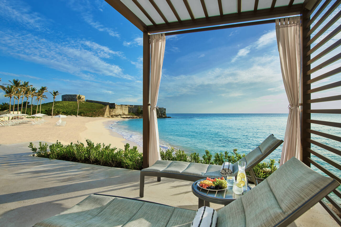 Oceanfront seating with table of fruit and water