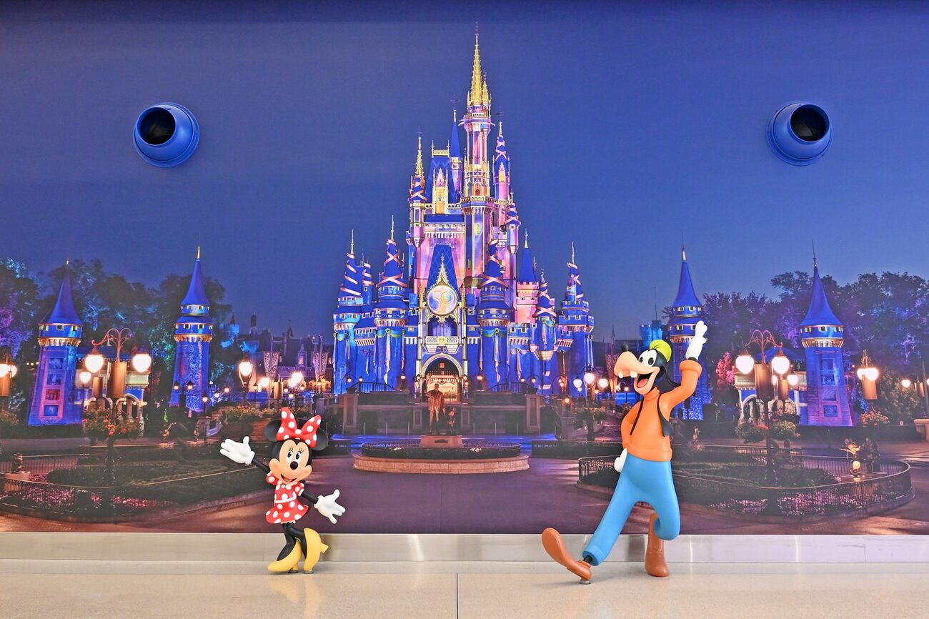 Disney castle with Minnie Mouse and Goofy 