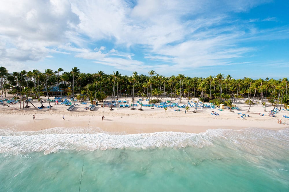 An aerial view of the beach and its lounge chairs at the RIU Hotels & Resorts complex on Arena Gorda.