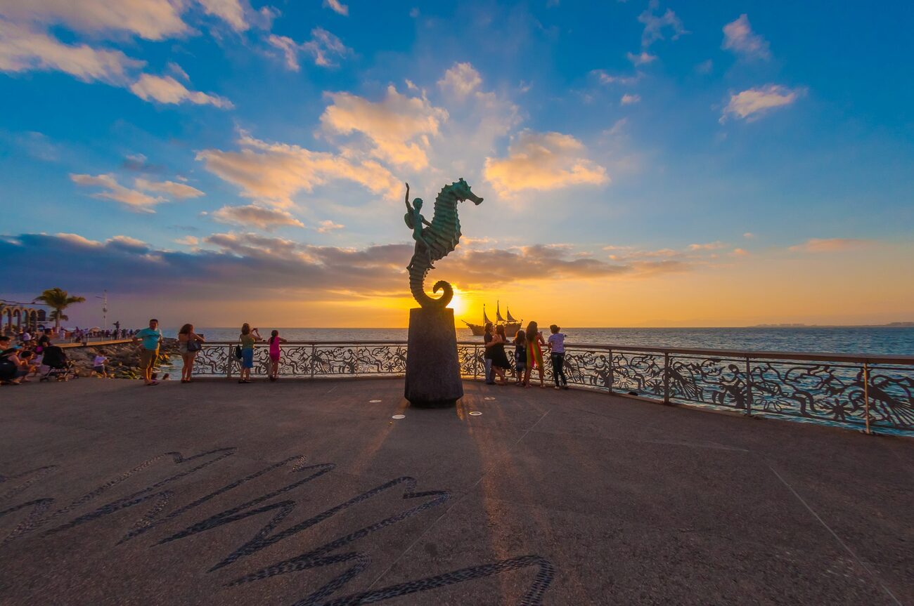 Malecon Boardwalk with a statue of a seahorse in front of the ocean